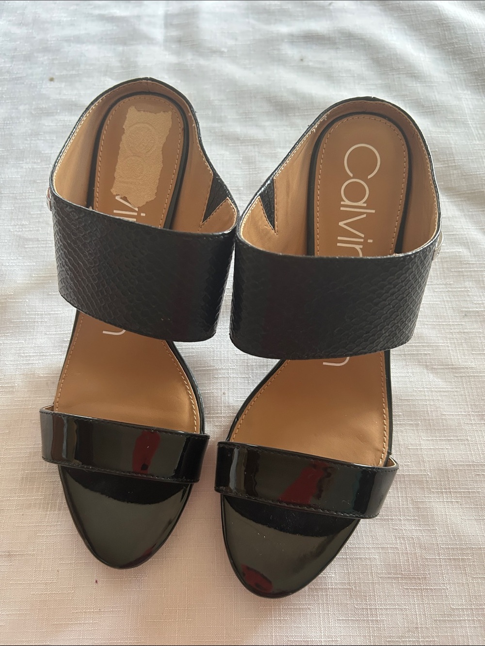 Calvin Klein Black Two-Strap Slide Heels have peel inside check the picture